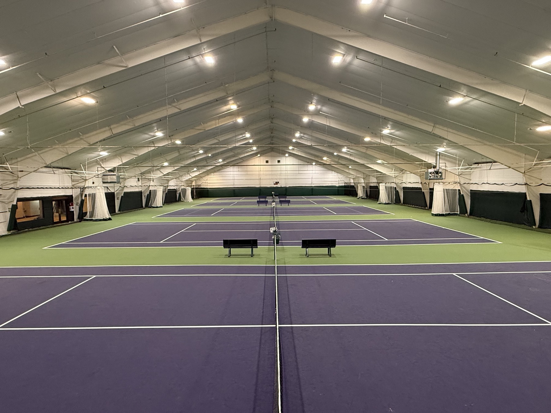 Five indoor tennis courts under one vaulted roof at Beaverton Sports Club